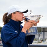 Iga Swiatek of Poland poses with her champions trophy after winning the final in Rome