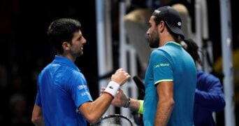 Tennis - ATP Finals - The O2, London, Britain - November 10, 2019 Serbia's Novak Djokovic shakes hands with Italy's Matteo Berrettini after winning their group stage match