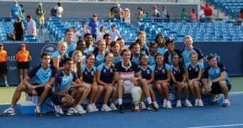 Daniil Medvedev of Russia poses for a photo with volunteers with the Rookwood Cup trophy after winning the Western & Southern Open at Lindner Family Tennis Center on August 18, 2019 in Mason, Ohio