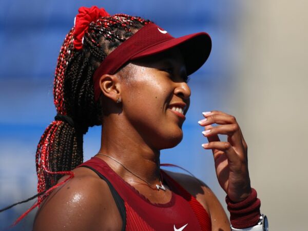 Ariake Tennis Park - Tokyo, Japan - July 25, 2021. Naomi Osaka of Japan celebrates after winning her first round match against Zheng Saisai of China