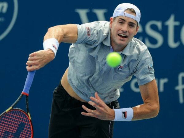 John Isner (USA) serves the ball against Cameron Norrie (GBR) during the Western and Southern Open tennis tournament at Lindner Family Tennis Center