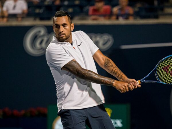 Nick Kyrgios returns a ball from the United States' Reilly Opelka during National Bank Open men's tennis action, in Toronto, Monday, Aug. 9, 2021.
