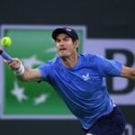 Andy Murray (GBR) hits a shot against Adrian Mannarino (FRA) at Indian Wells Tennis Garden.