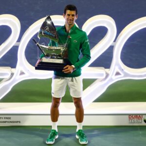 Serbia's Novak Djokovic poses with the trophy after winning the Final against Greece's Stefanos Tsitsipas at the Dubai Duty Free Tennis Championships
