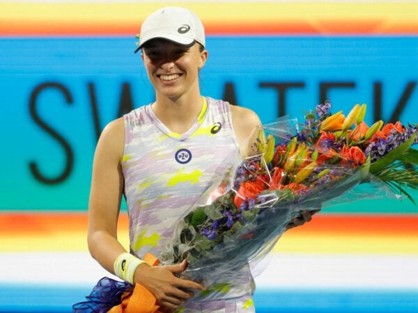 Iga Swiatek (POL) is presented a bouquet for becoming the number one women's player in the world after her victory over Victorija Golubic (SUI) (not pictured) in a second round women's singles match in the Miami Open at Hard Rock Stadium.