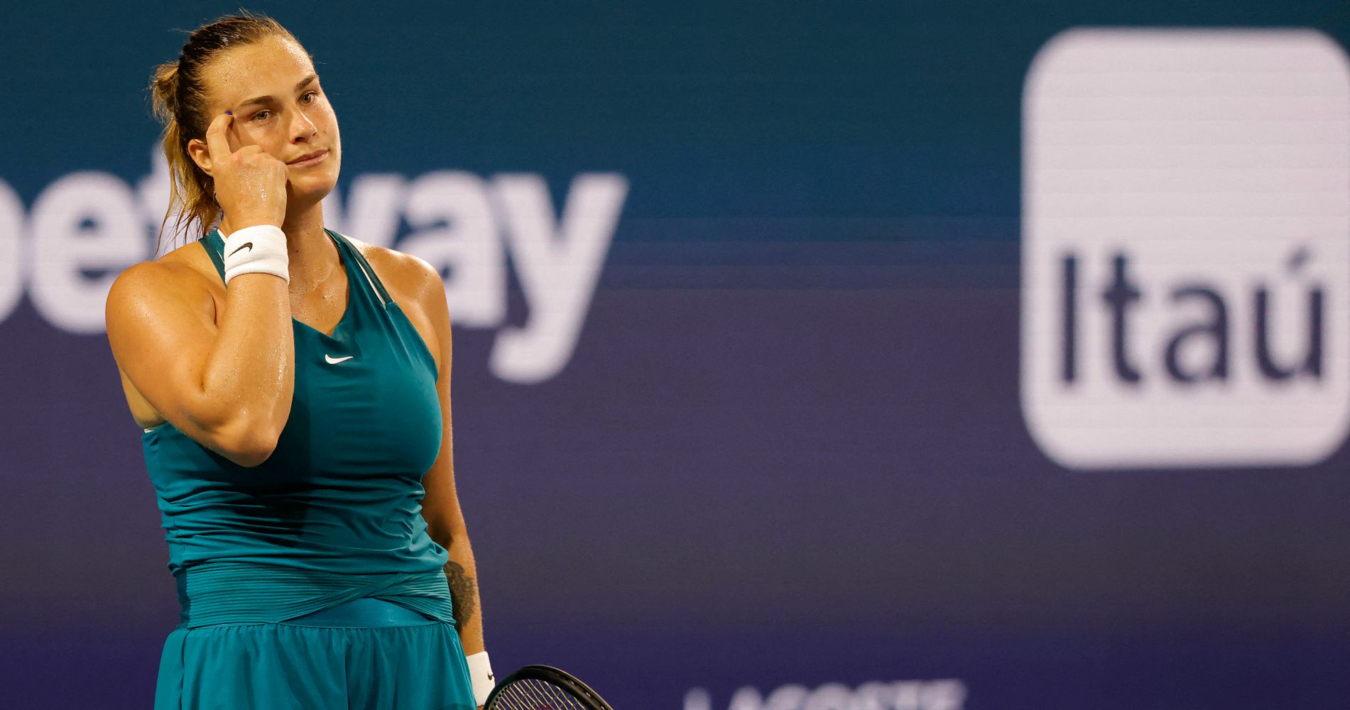 Aryna Sabalenka gestures after missing a shot during her second round women's singles match in the Miami Open at Hard Rock Stadium.