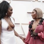 Venus Williams, left, and Serena Williams arrive at the Oscars on Sunday, March 27, 2022, at the Dolby Theatre in Los Angeles.