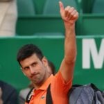 Novak Djokovic acknowledges spectators as he walks off the court after losing his second round match against Spain's Alejandro Davidovich Fokina at the Rolex Monte-Carlo Masters 2022