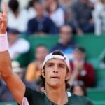 Lorenzo Musetti points to the sky