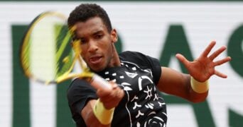 Canada's Felix Auger-Aliassime in action during his first round match against Peru's Juan Pablo Varillas