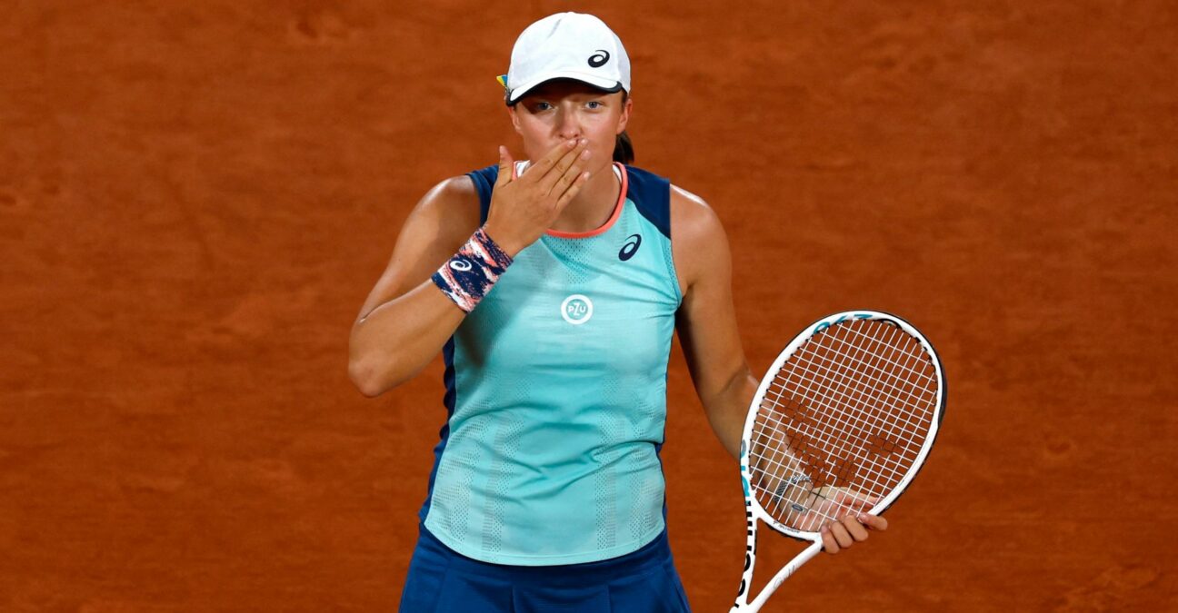Poland's Iga Swiatek celebrates winning her first round match against Ukraine's Lesia Tsurenko