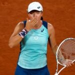 Poland's Iga Swiatek celebrates winning her first round match against Ukraine's Lesia Tsurenko