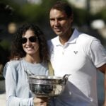 Spain's Rafael Nadal poses with his wife Maria Francisca Perello and the trophy after winning the men's singles French Open title
