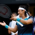 Serena Williams of the U.S. with Tunisia's Ons Jabeur during their round of 16 double match at Eastbourne International Tournament