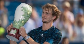 Alexander Zverev poses with the trophy after winning the Western and Southern Open final in Cincinnati