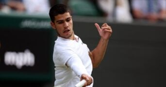action during his third round match against Germany's Oscar Otte at Wimbledon 2022