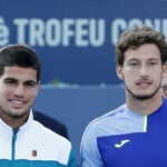 Spain's Carlos Alcaraz alongside compatriot Pablo Carreno Busta at the 2022 Barcelona Open