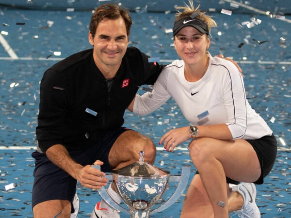 Roger Federer and Belinda Bencic with the 2019 Hopman Cup trophy