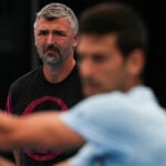 Serbia's Novak Djokovic practices as coach Goran Ivanisevic looks in Adelaide on December 30, 2022.