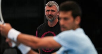 Serbia's Novak Djokovic practices as coach Goran Ivanisevic looks in Adelaide on December 30, 2022.