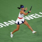 Emma Raducanu hits a shot against Aliaksandra Sasnovich at Indian Wells Tennis Garden in 2021