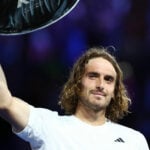 Stefanos Tsitsipas with the runners-up trophy after losing his final match against Serbia's Novak Djokovic at the 2023 Australian Open