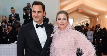 Roger Federer and his wife Mirka Federer pose at the Met Gala