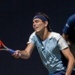 Taylor Fritz grass