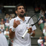 Novak Djokovic speaks to the Chair Umpire during the 2023 Wimbledon final