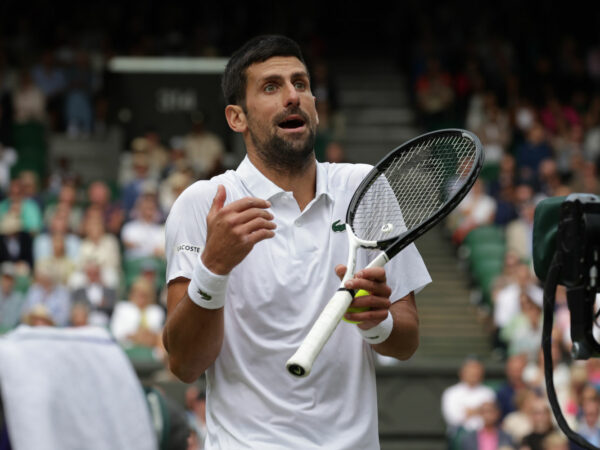 Novak Djokovic speaks to the Chair Umpire during the 2023 Wimbledon final