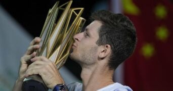 Hubert Hurkacz of Poland kisses his winning trophy after defeating Andrey Rublev in Shanghai