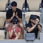 Daria Abramowicz, in red, watching Iga Swiatek's triumph in Paris.