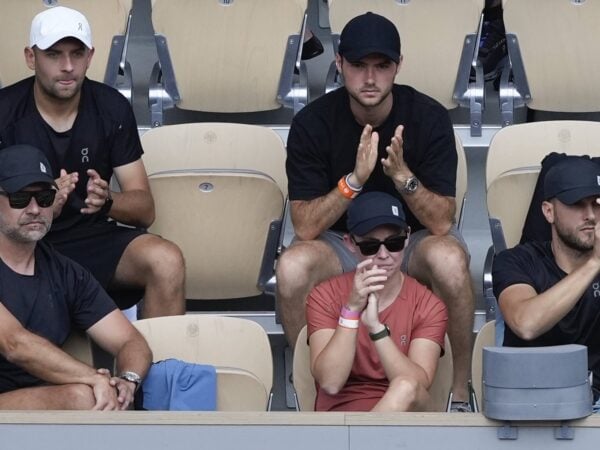 Daria Abramowicz, in red, watching Iga Swiatek's triumph in Paris.