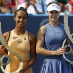 Leylah Fernandez (CAN) and Anna Kalinskaya pose with the championship and finalist trophies, respectively, after their women's singles final of the Mubadala Citi DC Open