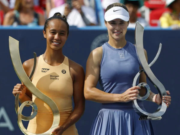 Leylah Fernandez (CAN) and Anna Kalinskaya pose with the championship and finalist trophies, respectively, after their women's singles final of the Mubadala Citi DC Open