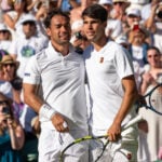 Fabio Fognini and Carlos Alcaraz meet at the net after Alcaraz wins the Wimbledon 2025 Men’s Singles first round tennis match between Fabio Fognini and Carlos Alcaraz at the All England Tennis Club in London, England. ((6257) / SPP)