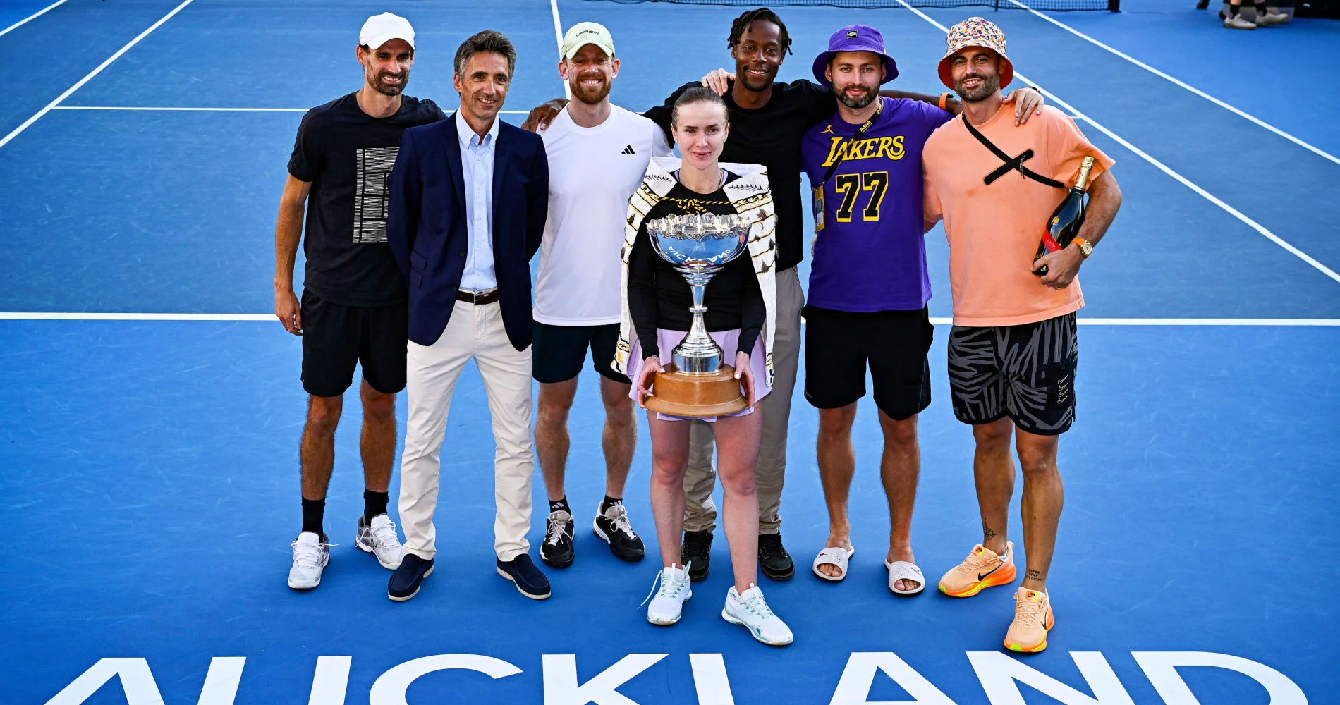 Elina Svitolina and her team, including Gaël Monfils, with the 2026 ASB Classic trophy. © Photosport / PsNewz