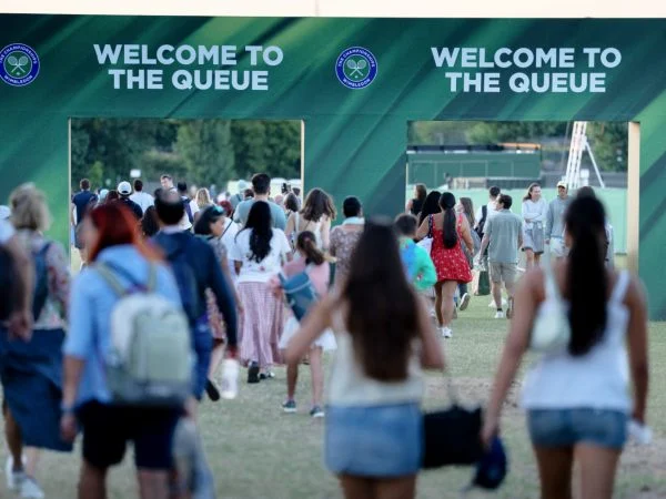 Early morning queue for tickets in Wimbledon Park at The Championships 2025