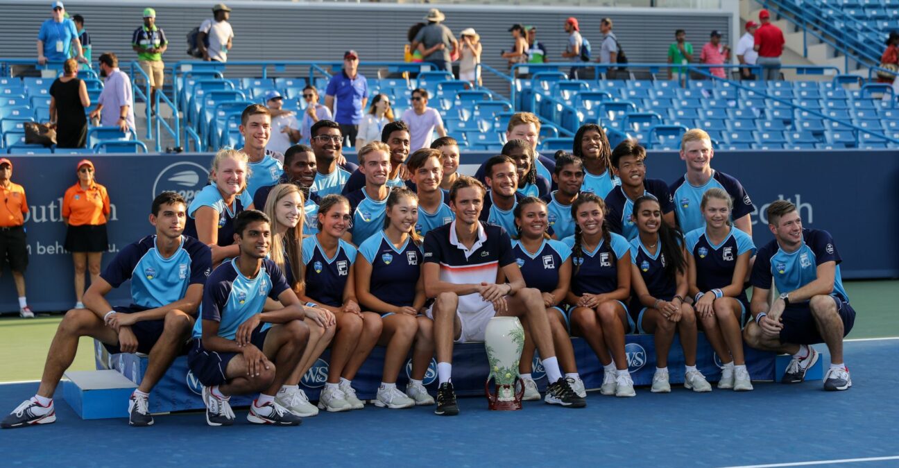 Daniil Medvedev of Russia poses for a photo with volunteers with the Rookwood Cup trophy after winning the Western & Southern Open at Lindner Family Tennis Center on August 18, 2019 in Mason, Ohio