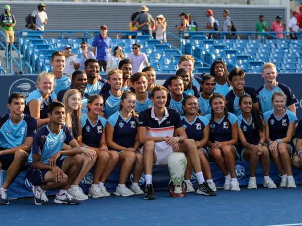 Daniil Medvedev of Russia poses for a photo with volunteers with the Rookwood Cup trophy after winning the Western & Southern Open at Lindner Family Tennis Center on August 18, 2019 in Mason, Ohio