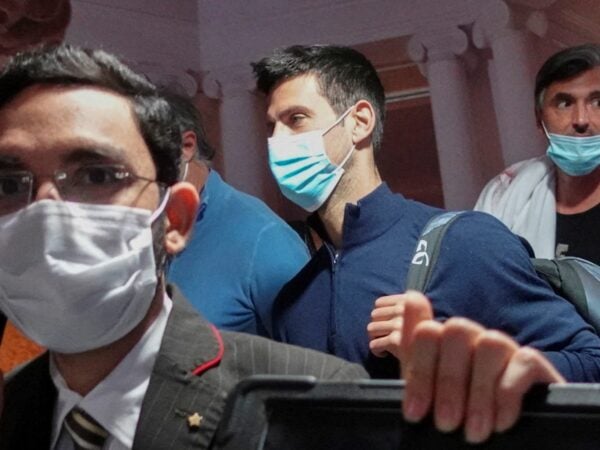 Novak Djokovic walks with his team after landing at Dubai Airport after the Australian Federal Court upheld a government decision to cancel his visa to play in the Australian Open on January 17, 2022.