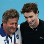 France's Ugo Humbert with French team captain Nicolas Copin after winning his group stage match against Russia's Daniil Medvedev