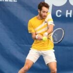Constant Lestienne playing a backhand during a match at the Challenger of Lille 2022