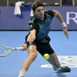 Arthur Rinderknech from France hits a slice forehand while playing against Holger Rune in semi-final in Basel in 2022