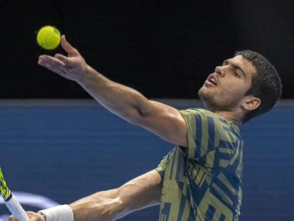Carlos Alcaraz toss the ball for a serve during his first round match against Jack Draper in Basel in 2022