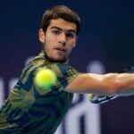 Carlos Alcaraz hits a slice backhand againt Pablo Carreno Busta in Basel