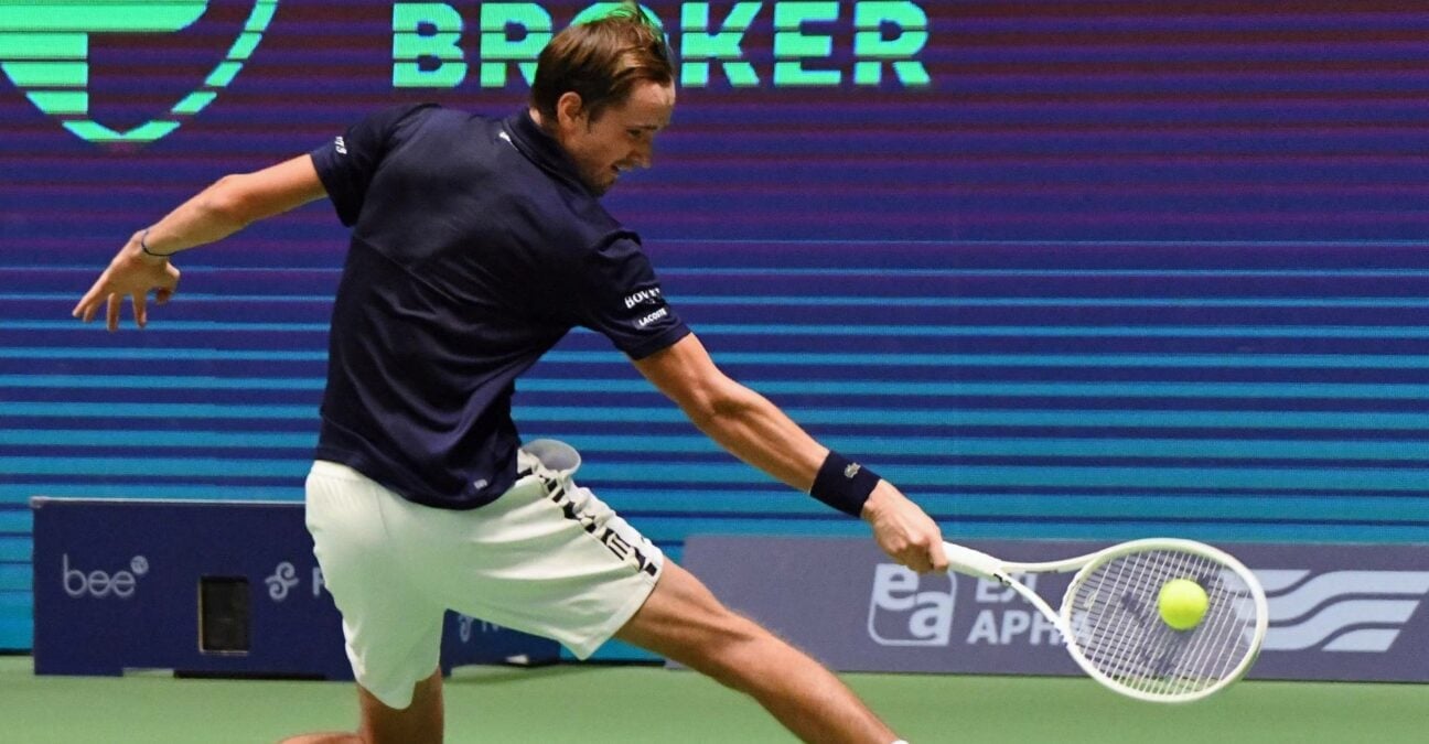 Daniil Medvedev hits a slice backhand against Novak Djokovic during their semi-final in Astana in 2022