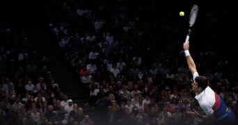 Novak Djokovic hits a serve during the finale of the Rolex Paris Masters 2022 against Daniil Medvedev.