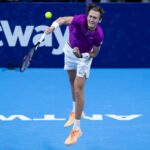 Sebastian Korda hits a serve during his victory against Dominic Thiem in the semi-final of Antwerp in 2022