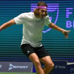 Stefanos Tsitsipas hits a slice backhand agains Novak Djokovic during the final of the tournament of Astana in 2022
